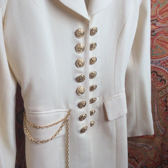 White coat with gold best sale buttons