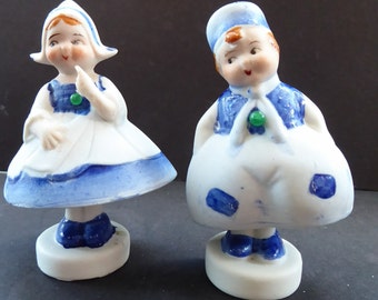 Japanese Bisque Nodder Figures of a Little Vintage DUTCH Boy and Girl. They wobble about from side to side, as if dancing!