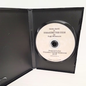 May include: A DVD case with a white disc inside. The disc has text that reads "Derek Jacobi in Breaking the Code by Hugh Whitemore Producer's Cut Princeton Turing Centennial 2012".