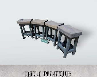 May include: Four gray wooden stools with a curved seat and a dark gray painted base. The stools are arranged in a row and are all the same size. The stools are made of reclaimed wood and have a rustic look. The text "UNIQUE PRIMTIQUES" is visible in the image.