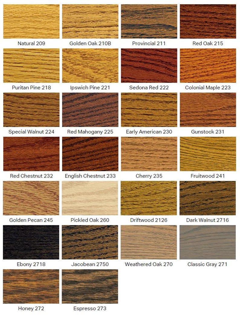 May include: A grid of twenty-six wood stain color samples, each displaying a unique wood grain texture and tone. Labels include Natural 209, Golden Oak 210B, Provincial 211, Red Oak 215, Puritan Pine 218, Ipswich Pine 221, Sedona Red 222, and Colonial Maple 223.