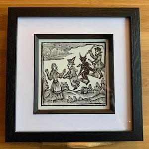 Framed print of Woodcut Witches and Devil on Broomstick