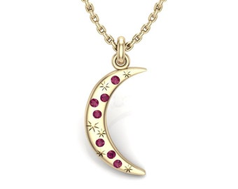 May include: A gold crescent moon pendant necklace with small red gemstones and star accents.