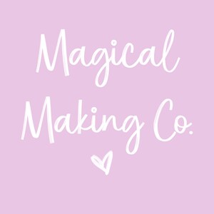 May include: White text on a light pink background reads "Magical Making Co." with a small heart symbol below the text.