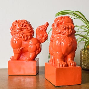 May include: A set of three ceramic mugs with a speckled, matte finish in cream, light grey, and dark grey. Each mug has a simple, minimalist design, ideal for coffee or tea.