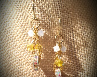 Iridescent Swarovski Crystals in Silver Discs with White and Yellow Swarovski Crystal Clusters on Gold Finished Steel Earrings