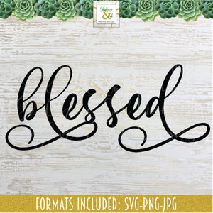 May include: Black and white cursive font design of the word "blessed" on a white wood background.