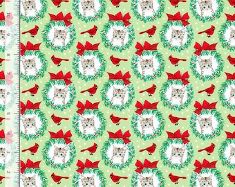May include: A light green fabric featuring a repeating pattern of kittens inside green wreaths with red bows, interspersed with red cardinals and white polka dots. A ruler along the left and bottom edges shows a scale of 11 inches.