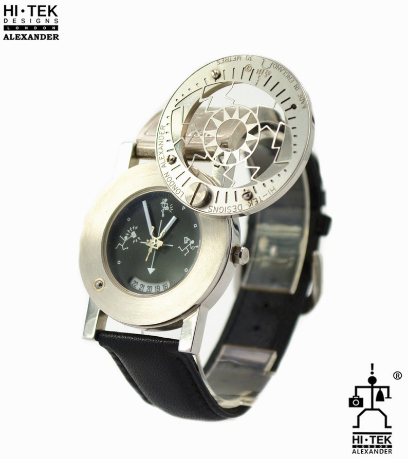 May include: A silver wristwatch with a black leather band. The watch face has a black background with white markings and a small window displaying the date. The watch has a unique design with a rotating outer ring that features a compass and a scale in meters.