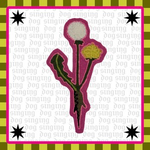 May include: A pink patch with a dandelion design, including a white seed head and a yellow flower. The patch has green leaves and stems. The background features the words "singing dog" and black star shapes.