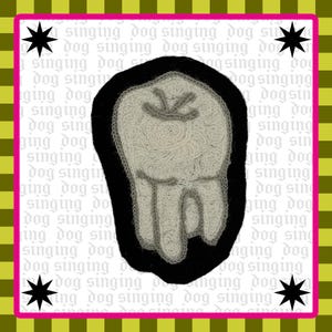 May include: A square patch featuring a light gray embroidered tooth design on a black background. The background behind the patch is white with the repeating text "singing dog" in a light gray font, framed by a lime green and black checkered border.