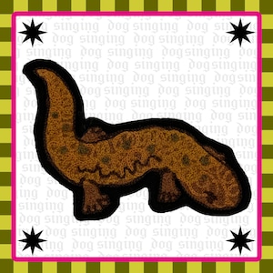 May include: A brown salamander-shaped patch with dark spots and a black outline, centered on a white background featuring the repeating text "singing dog" and four black star icons, all framed by a bright pink border and olive green checkered edge.