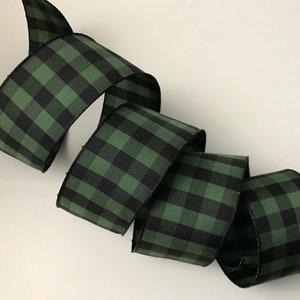 May include: Green and black plaid ribbon with a woven texture.