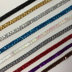 May include: Assortment of sparkly trim with various colors including black, gold, silver, turquoise, white, gray, red, purple, and brown.