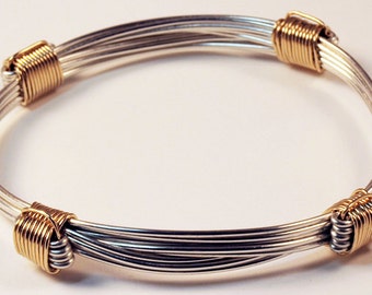 Elephant hair bracelet in African silver style with 4 gold knots