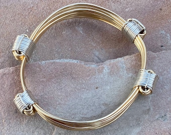 Gold elephant hair bracelet with 4 silver knots