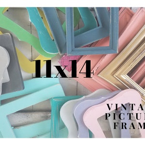 May include: A collection of colorful vintage picture frames in various shapes and sizes. The frames are painted in shades of blue, green, pink, gold, and gray. The text "11x14" is displayed in black, along with the words "VINTAGE PICTURE FRAME".