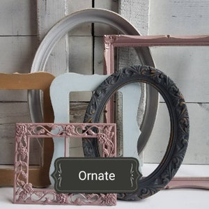 May include: A collection of ornate picture frames in various shapes and colors. The frames include a gold, light blue, pink, and black oval frame. The word "Ornate" is displayed on a dark gray label.