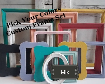 May include: A collection of assorted empty picture frames in various shapes, sizes, and colors including teal, white, peach, yellow, red, black, and lavender. The text "Pick Your Colors Custom Frame Set" and "Mix" are printed on the image.