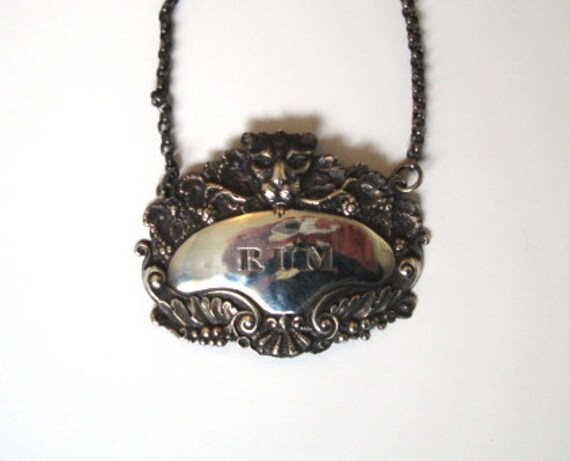 Antique Georgian Leopards Head Silver Rum Wine Label