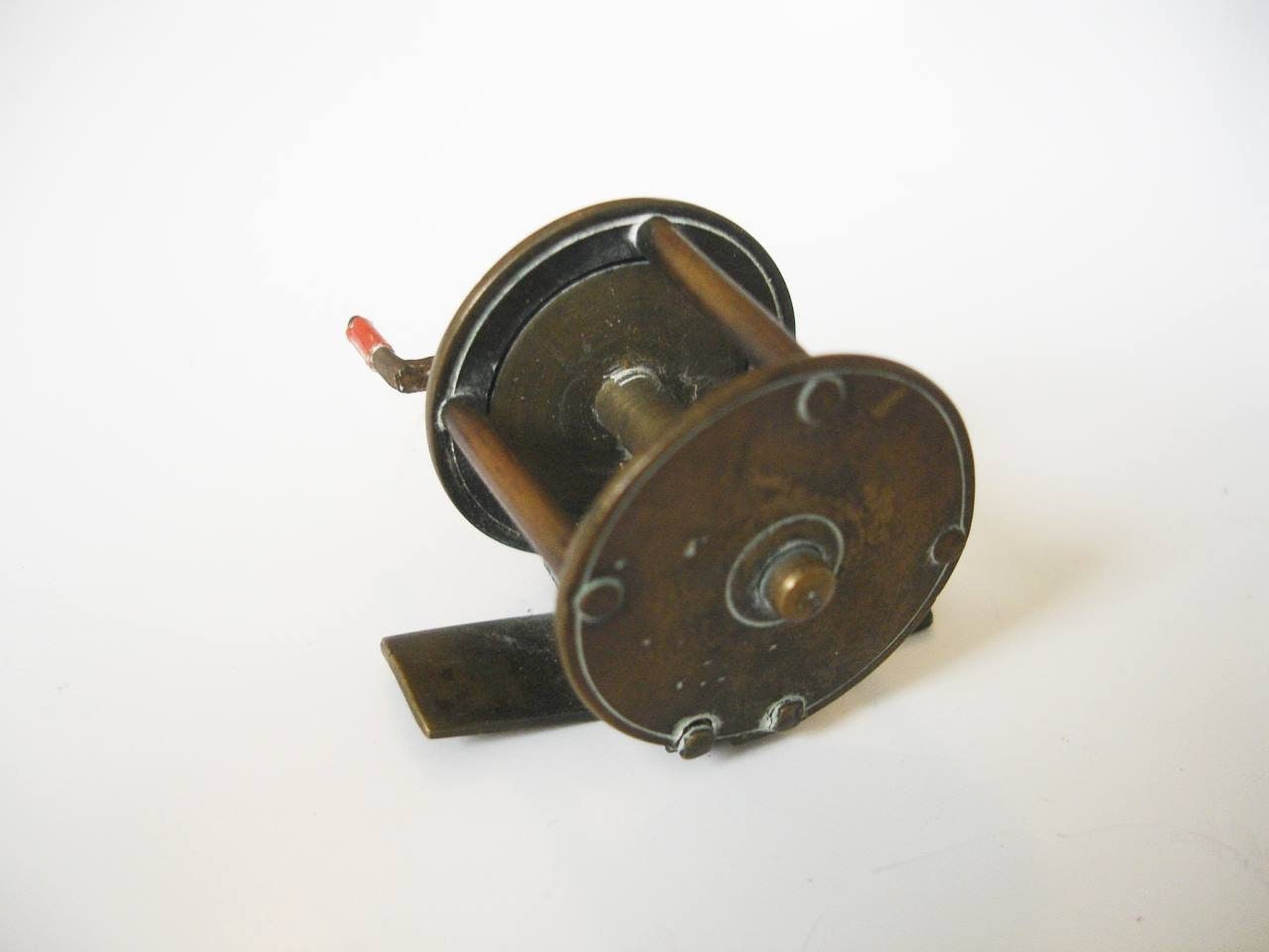 Antique brass salmon crank wind reel c 1870, 3.75 on off ratchet