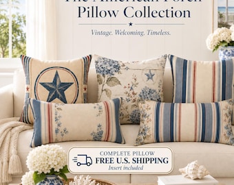 May include: A collection of decorative throw pillows featuring a mix of square and rectangular shapes with blue, red, and cream patterns including stars, floral hydrangea prints, and vertical stripes, displayed on a sofa with text above.