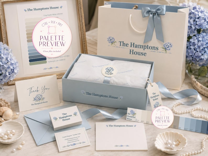 May include: A branded stationery set from The Hamptons House featuring a light blue gift box, a matching paper shopping bag with a blue ribbon, a thank you card, business cards, note cards, and a color palette preview sheet with blue hydrangea motifs.