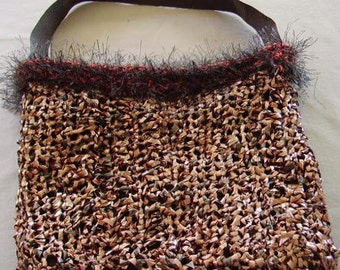 Handmade crocheted bag made from recycled audio tape and eyelash yarn