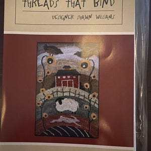 May include: A punchneedle embroidery pattern titled Threads That Bind, Country Layers by Shawn Williams, #625. The design features a red barn, a white sheep, and a rabbit in a landscape with sunflowers, measuring 4 1/2 inches by 6 1/2 inches.