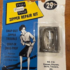 May include: Vintage Dritz Snag-Pruf Zipper Repair Kit. The package is blue and yellow with the text "ZIPPER REPAIR KIT". It includes a graphic of a woman and the text "SNAP-OUT ZIPPER TROUBLE". The kit is for dresses, blouses, skirts, and trousers.