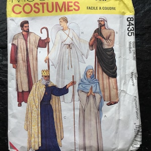May include: A sewing pattern for five nativity costumes. The pattern includes an angel, a shepherd, a wise man, Mary, and Joseph. The pattern is for sizes 36-38 and is labeled "Easy to Sew".