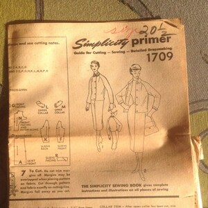 May include: A vintage Simplicity sewing pattern guide for dressmaking, featuring a woman in a dress and a jacket. The pattern number is 1709 and the guide includes instructions for cutting, sewing, and detailed dressmaking.
