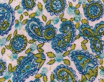 May include: A white fabric with a paisley pattern in shades of blue and green.