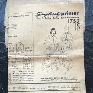 May include: A vintage sewing pattern for a blouse with a collar and wristband. The pattern is for sizes 16, 18, 20, 40, and 42. The pattern is for fabric without nap. The pattern includes instructions for cutting and sewing the blouse. The pattern is from Simplicity and is number 1753.