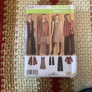 May include: Simplicity sewing pattern number 2866, easy-to-sew, for sizes 20W-W, EUR 45-54, F48-56. The pattern includes four different styles: a dress with a vest, a dress with a jacket, a dress with a skirt, and pants with a blouse. The pattern is on a white background with a red and brown striped pattern.