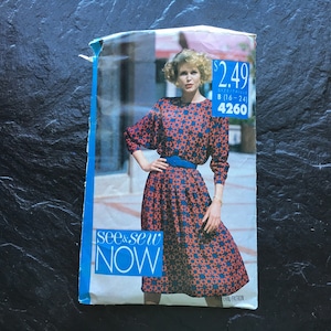 May include: A vintage sewing pattern for a dress with a floral print. The pattern is from the See & Sew Now brand and is for sizes 16-24. The pattern number is 4260.