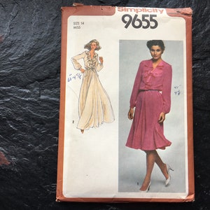 May include: Simplicity 9655 sewing pattern. The pattern features illustrations of two dresses, one in a light color and the other in pink. The pattern includes measurements of 68 4/8" and 45" 4/8". The pattern is size 14 Miss.