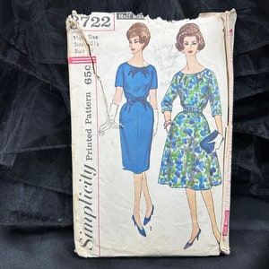 May include: Simplicity Printed Pattern 65C sewing pattern for a dress. The pattern shows two different styles of dresses, one in blue and one in a floral print. The pattern number is 3722.