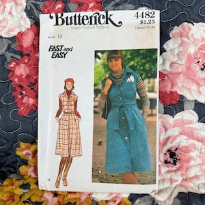 May include: Vintage sewing pattern for a sleeveless dress with a button-up front and a tie belt. The pattern is from Butterick and is labeled "Fast and Easy" with the number 4482. The pattern is for size 12.