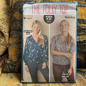 May include: Sewing pattern for a Polly top with a round neckline finish. The pattern is for sizes 8-22, US 6-20, UK 36-50. The pattern includes instructions on how to use shirring elastic.