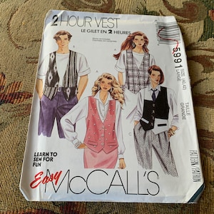 May include: A sewing pattern for a vest, titled "2 Hour Vest" and "Le Gilet en 2 Heures". The pattern is for sizes 40-42, or "Grande" in French. The pattern is from McCall's and is part of their "Easy" line. The pattern shows three different vest styles, one with a geometric print, one with a plaid print, and one with a solid color.