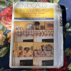May include: McCall's sewing pattern for mantel covers, featuring three different designs. The pattern is titled "More Splash Than Cash" and includes instructions for creating a "Tapis de Cheminée".
