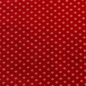 May include: Red fabric with a white diamond pattern.