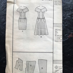May include: A black and white sewing pattern for a dress. The pattern includes instructions for two different styles of dresses, one with a fitted skirt and one with a flared skirt. The pattern is for size 35 inches (90 cm).