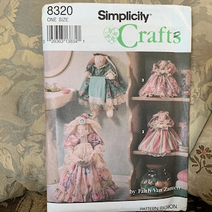 May include: A Simplicity Crafts sewing pattern for making three different doll-shaped items. The pattern is for one size and includes instructions for making a towel holder, a tissue box cover, and a jar cover. The pattern is by Faith Van Zanten.