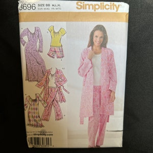 May include: A sewing pattern for a pink robe, pajamas, and a nightgown. The pattern is from Simplicity and is size BB, M, L, XL. The pattern number is 3696.