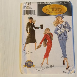 May include: A Simplicity pattern for doll clothes, featuring three outfits: a black dress with a white belt, a red skirt and jacket with a fur collar, and a blue pantsuit with white trim. The pattern is titled "Couturier Doll Clothes" and is part of Series 1.