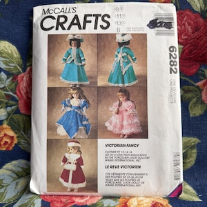 May include: McCall's Crafts sewing pattern for Victorian Fancy doll clothes. The pattern includes instructions for creating doll outfits in various styles, with dolls fitting 13-14-16 inches. The pattern features images of dolls in the finished outfits.