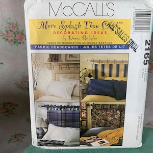 May include: McCall's sewing pattern for fabric headboards. The pattern features four headboard designs with various fabric styles. The cover includes the text "More Splash Than Cash" and "Fabric Headboards".