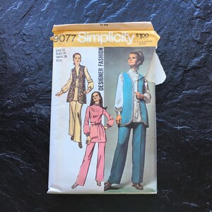 May include: Vintage Simplicity sewing pattern number 3077 for a pantsuit with a vest. The pattern is for sizes 16, bust 38, waist 29, and is for misses. The pattern shows three different versions of the pantsuit, one with a floral print vest, one with a solid blue vest, and one with a pink top and pants.
